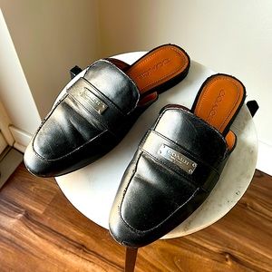 COACH leather mules with metal logo on top